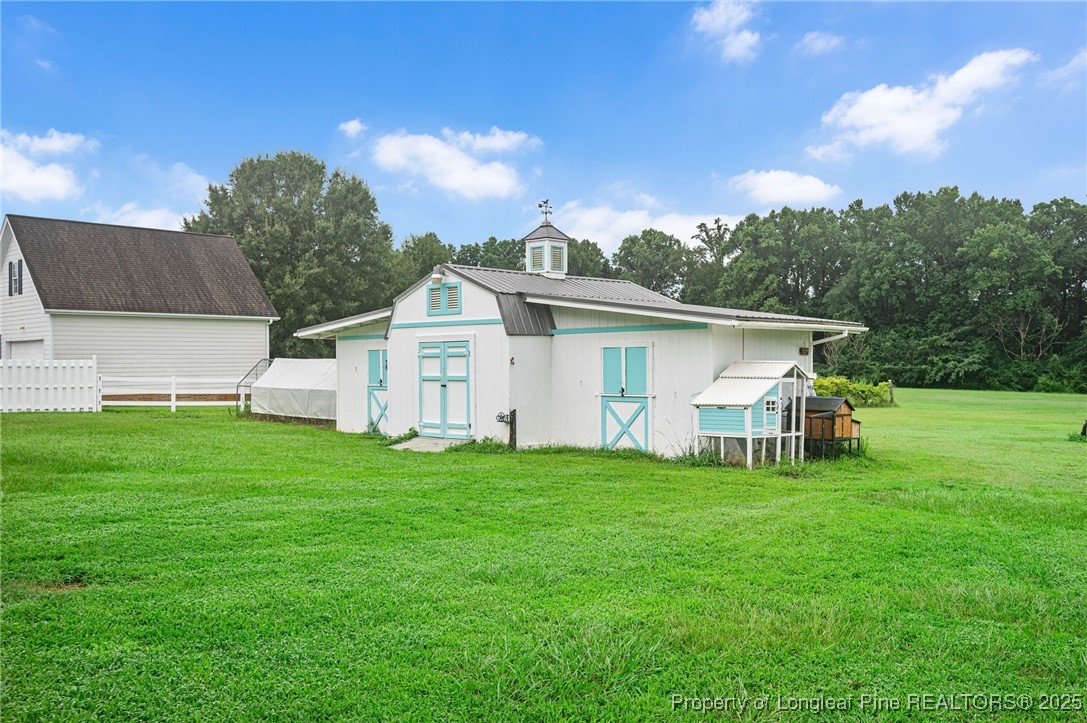 5247 Old Stage Road North Angier, NC 27501 - Photo 33 of 42 a view of a house with a yard and sitting area