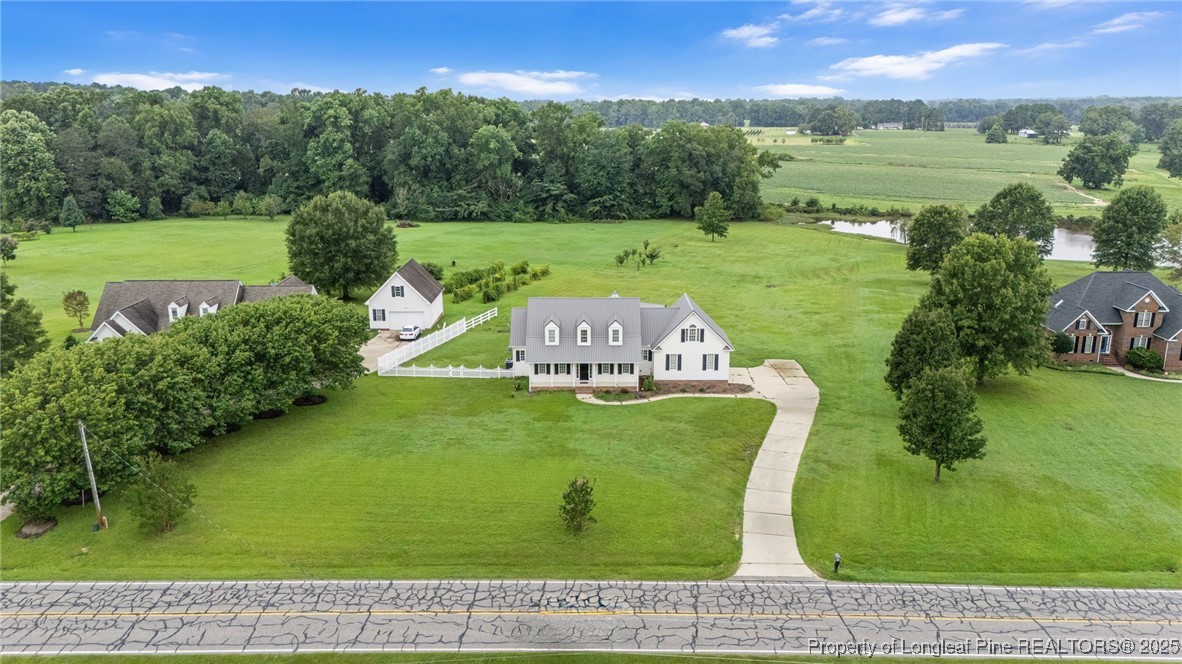 5247 Old Stage Road North Angier, NC 27501 - Photo 4 of 42 an aerial view of a golf course with a garden