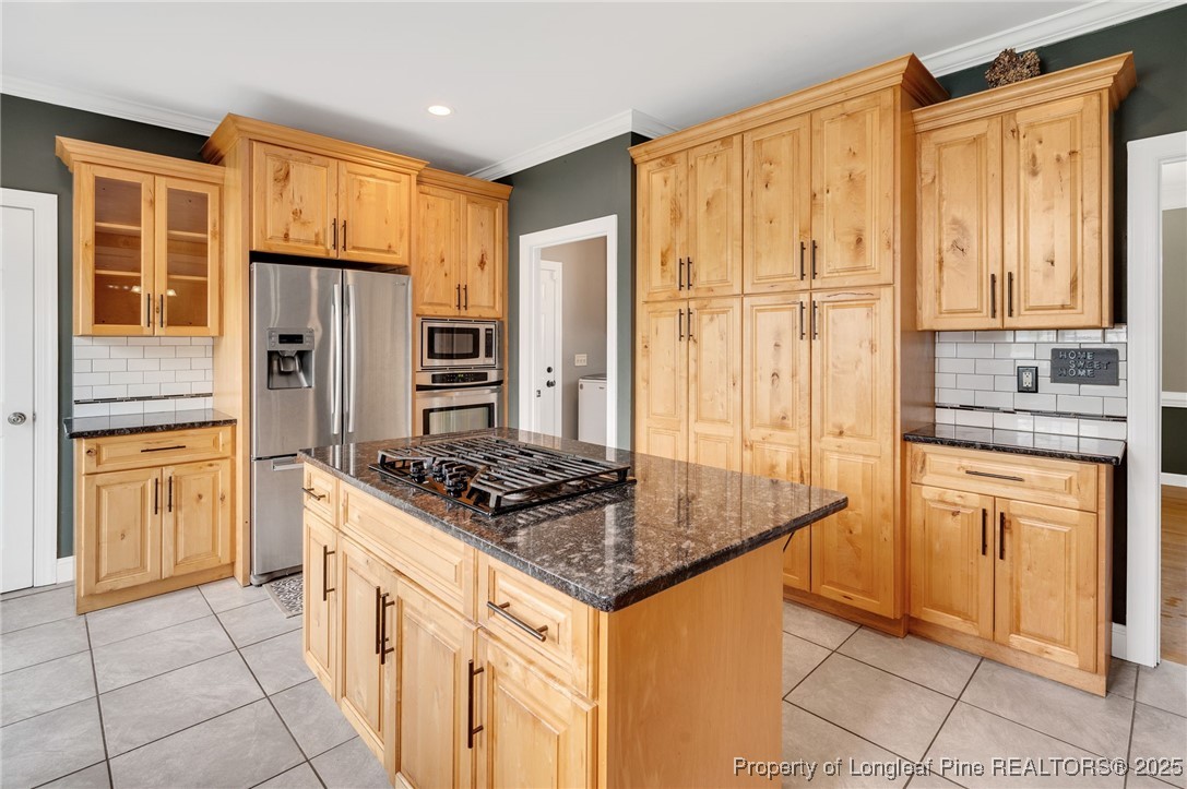 5247 Old Stage Road North Angier, NC 27501 - Photo 9 of 42 a kitchen with stainless steel appliances granite countertop a stove refrigerator and cabinets