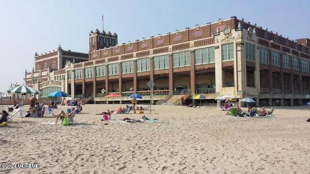 a group of people sitting in front of a building