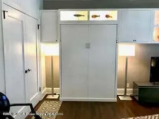 a view of kitchen with furniture and wooden floor