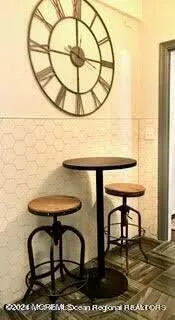 a view of a dining room with furniture and a table