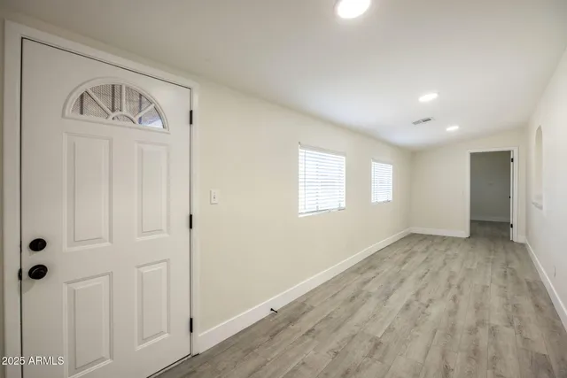 a view of an empty room and window