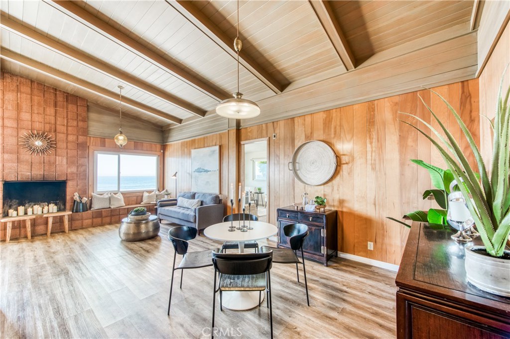 8 Ocean Front Lane, Unit AB Cayucos, CA 93430 - Photo 11 of 36 a view of a dining room with furniture window and wooden floor