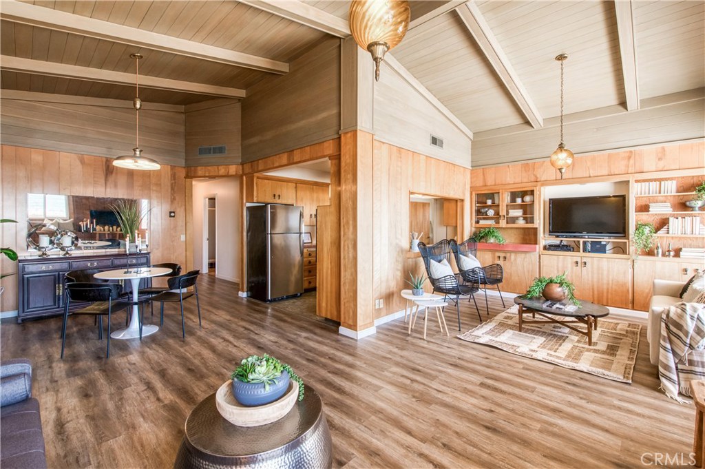 8 Ocean Front Lane, Unit AB Cayucos, CA 93430 - Photo 13 of 36 a living room with furniture and a flat screen tv