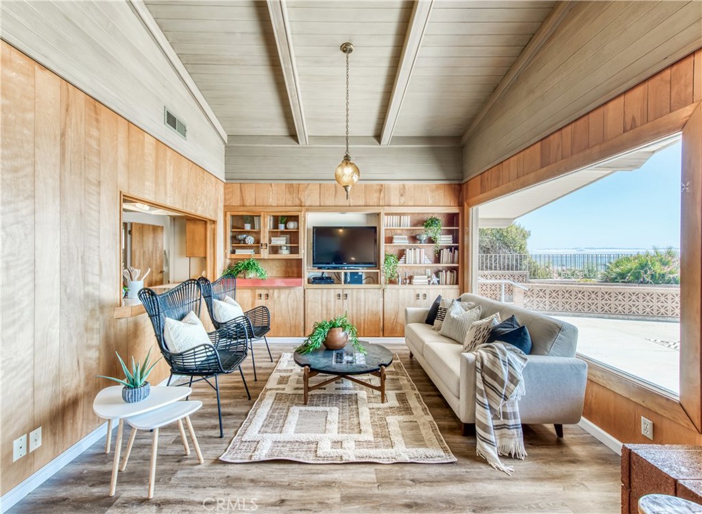 8 Ocean Front Lane, Unit AB Cayucos, CA 93430 - Photo 9 of 36 a living room with furniture and a floor to ceiling window