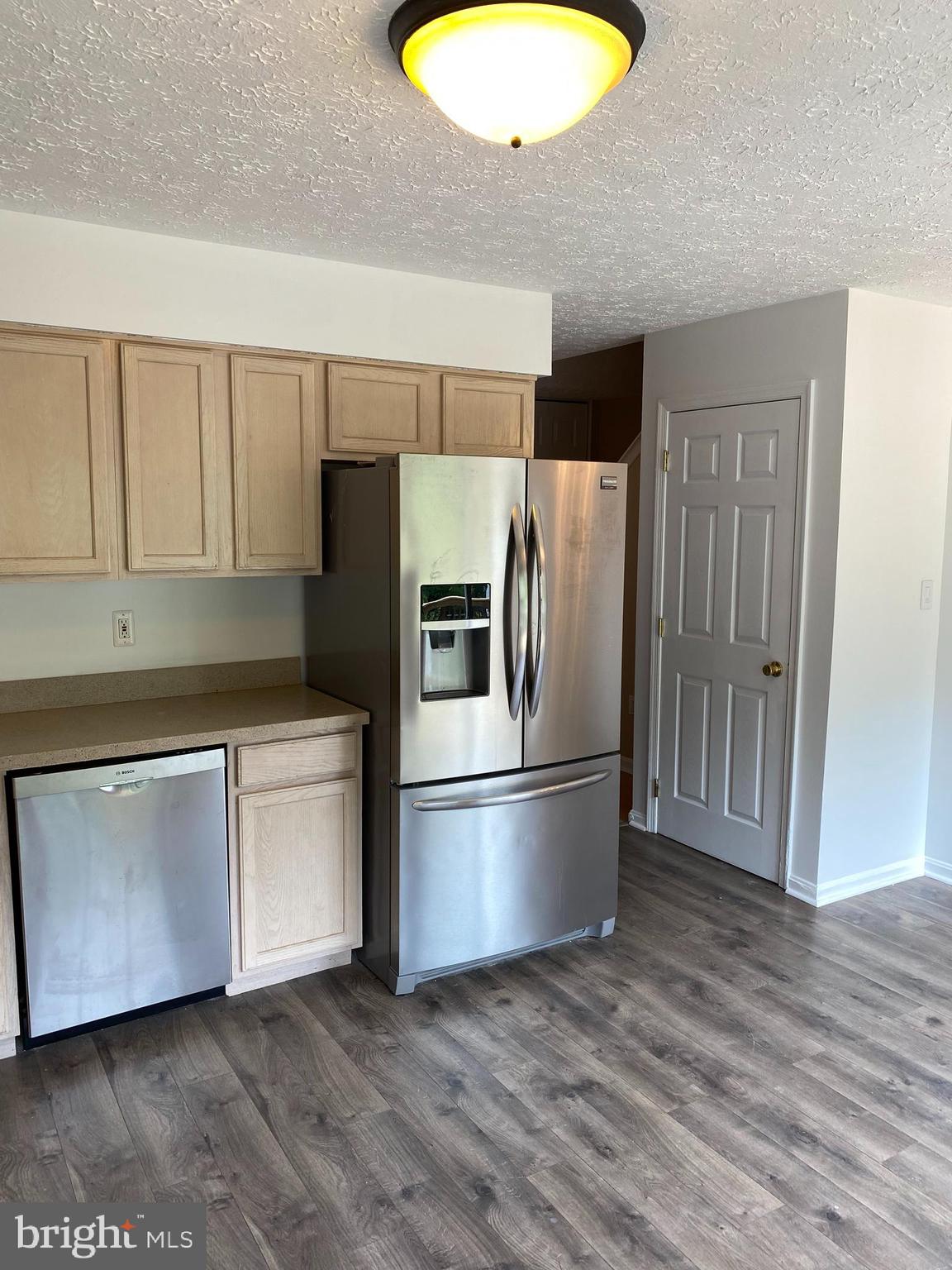 157 Carolstowne Road Reisterstown, MD 21136 - Photo 5 of 31 KITCHEN WITH STAINLESS STEEL REFRIGERATOR