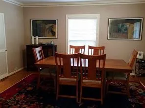 a bathroom with a granite countertop sink a mirror and shower