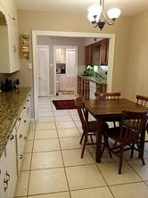 2103 Swift Boulevard Houston, TX 77030 - Photo 14 of 23 a dining hall with stainless steel appliances a dining table and chairs