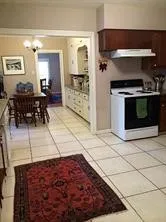 a kitchen with stainless steel appliances granite countertop a refrigerator and a stove