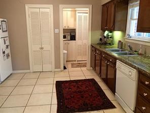 2103 Swift Boulevard Houston, TX 77030 - Photo 16 of 23 a large kitchen with granite countertop a sink and a stove