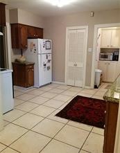 2103 Swift Boulevard Houston, TX 77030 - Photo 17 of 23 a kitchen with stainless steel appliances granite countertop a refrigerator and a stove