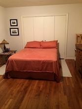 2103 Swift Boulevard Houston, TX 77030 - Photo 20 of 23 a bedroom with a bed and a painting on the wall