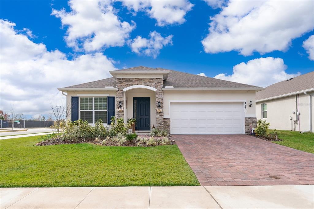 1550 Outback Road West St. Cloud, FL 34771 - Photo 1 of 1 a view of a yard in front of house