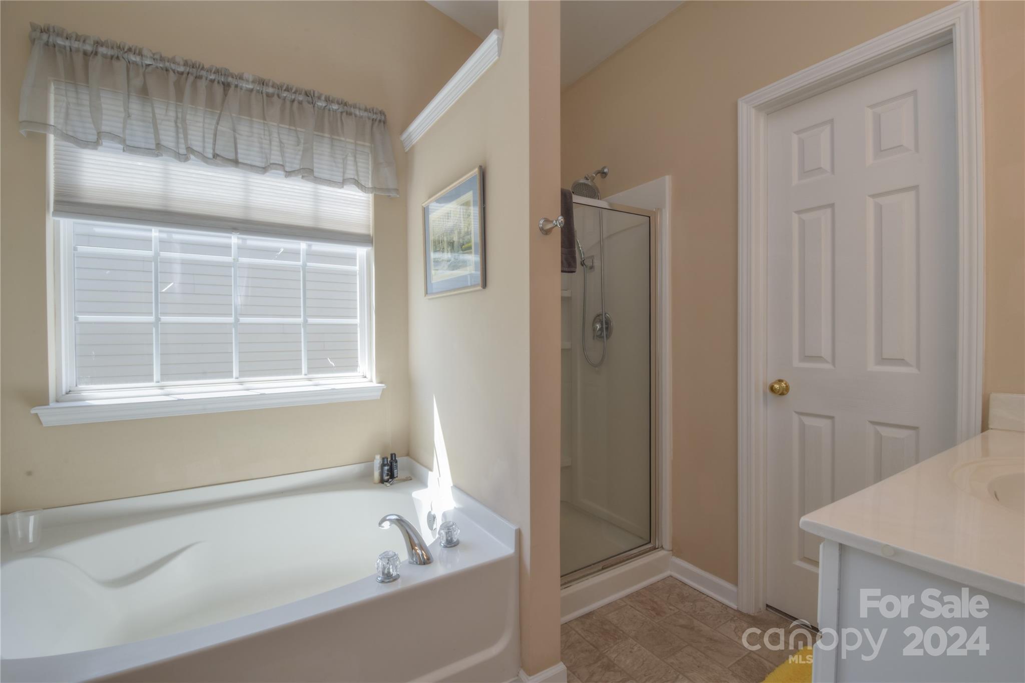 1472 Haverford Road Northwest Concord, NC 28027 - Photo 11 of 30 a white bath tub sitting next to a window