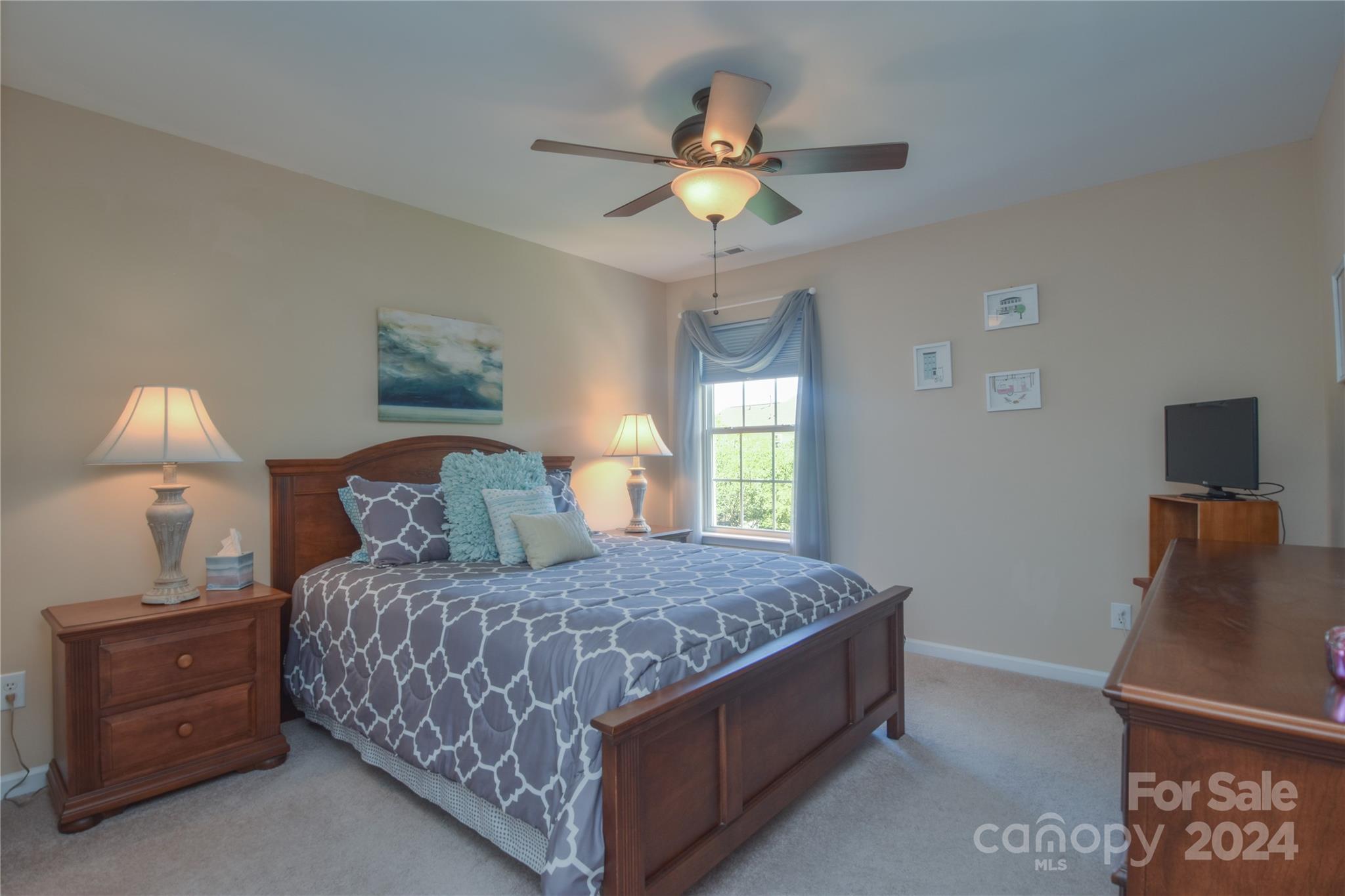 1472 Haverford Road Northwest Concord, NC 28027 - Photo 14 of 30 a bedroom with a bed and a lamp on dresser