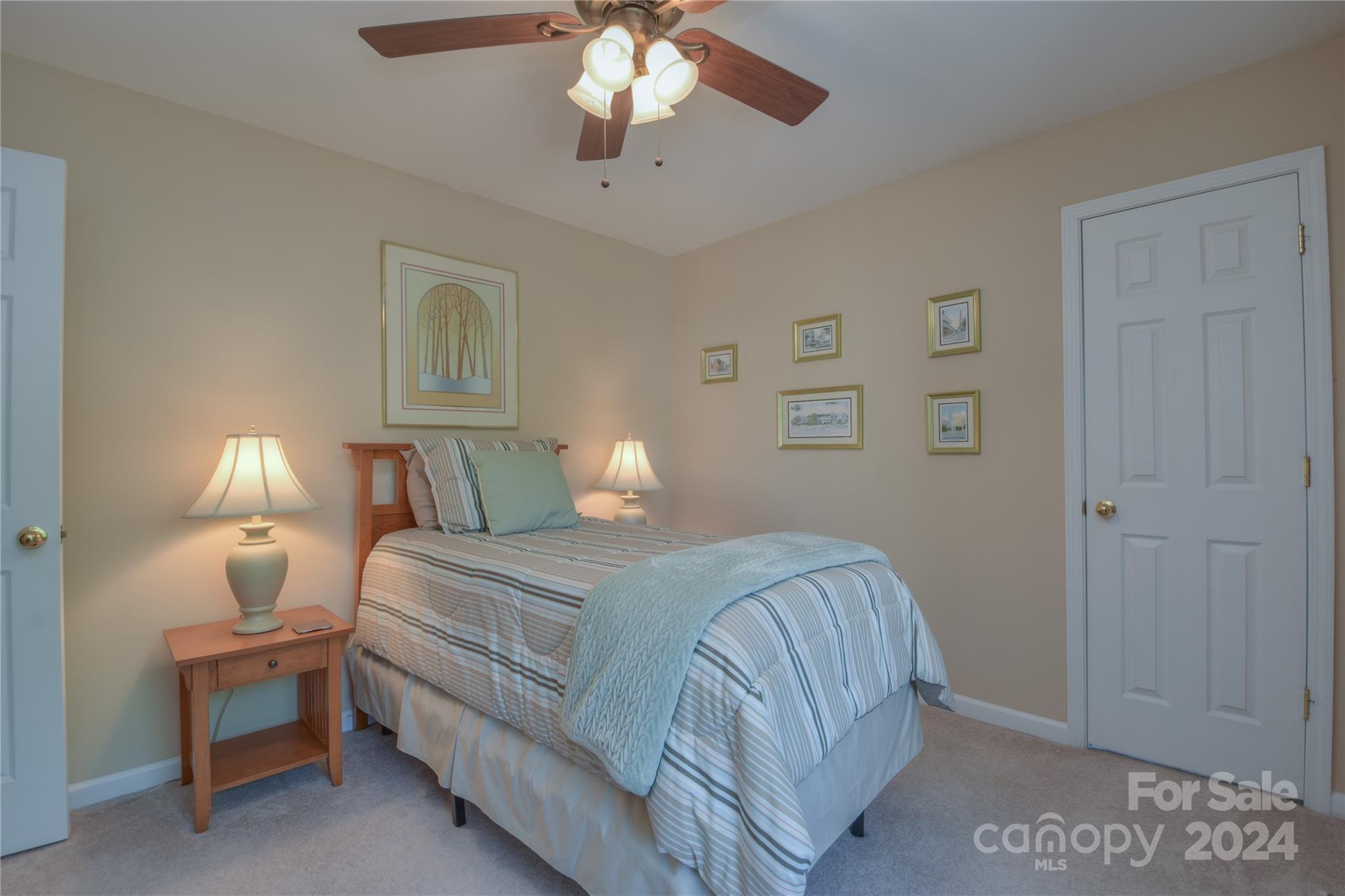 1472 Haverford Road Northwest Concord, NC 28027 - Photo 15 of 30 a bedroom with a bed and a chandelier