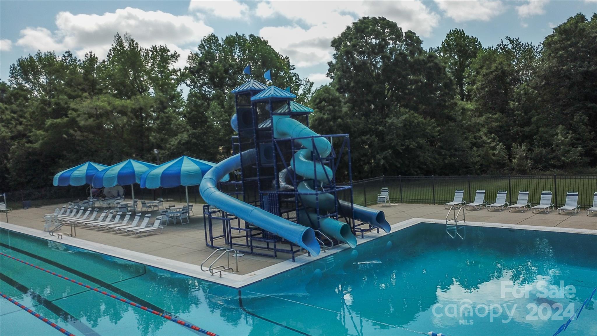 1472 Haverford Road Northwest Concord, NC 28027 - Photo 20 of 30 a view of a house with pool and chairs