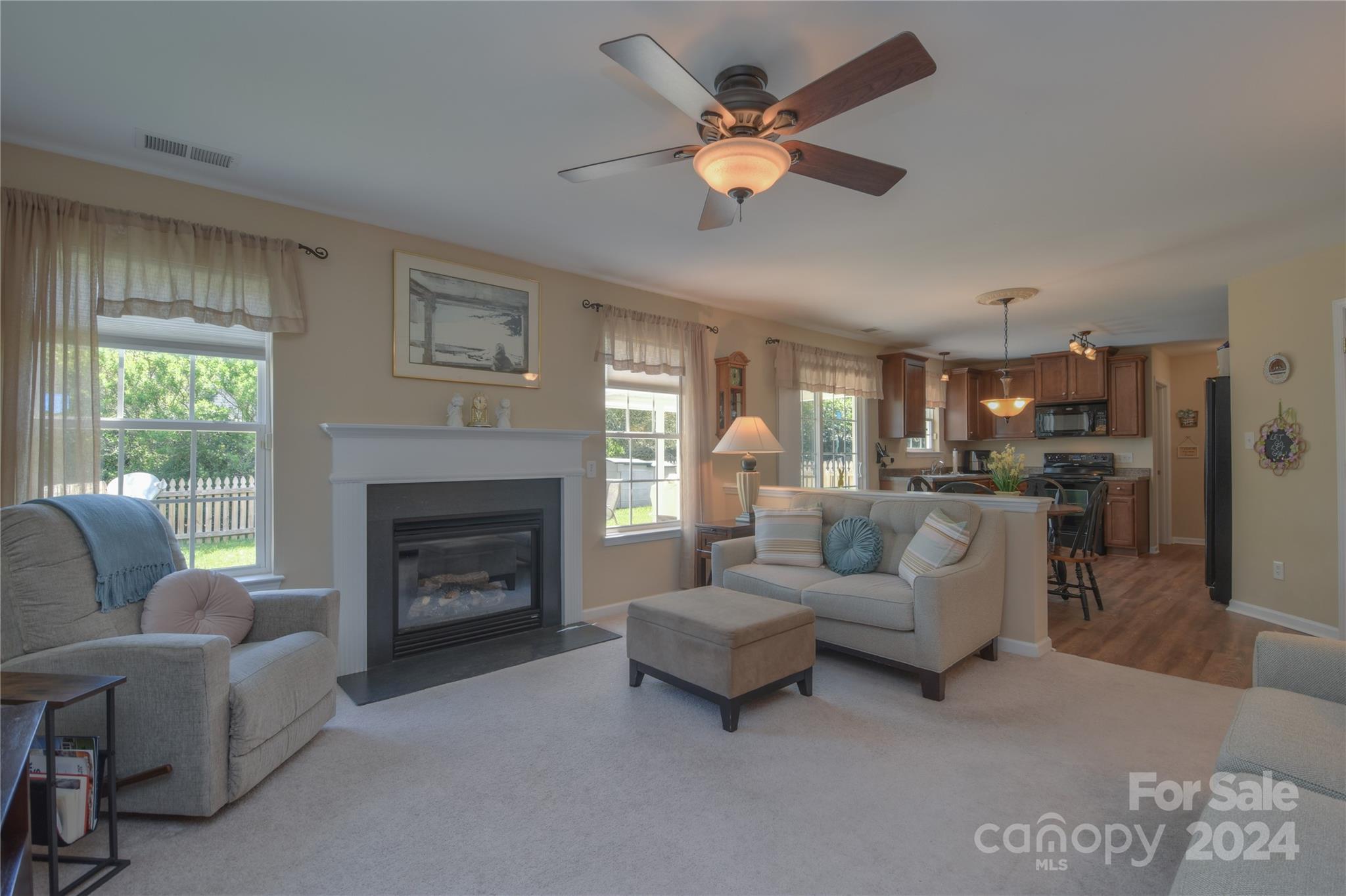 1472 Haverford Road Northwest Concord, NC 28027 - Photo 2 of 30 a living room with furniture and a fireplace