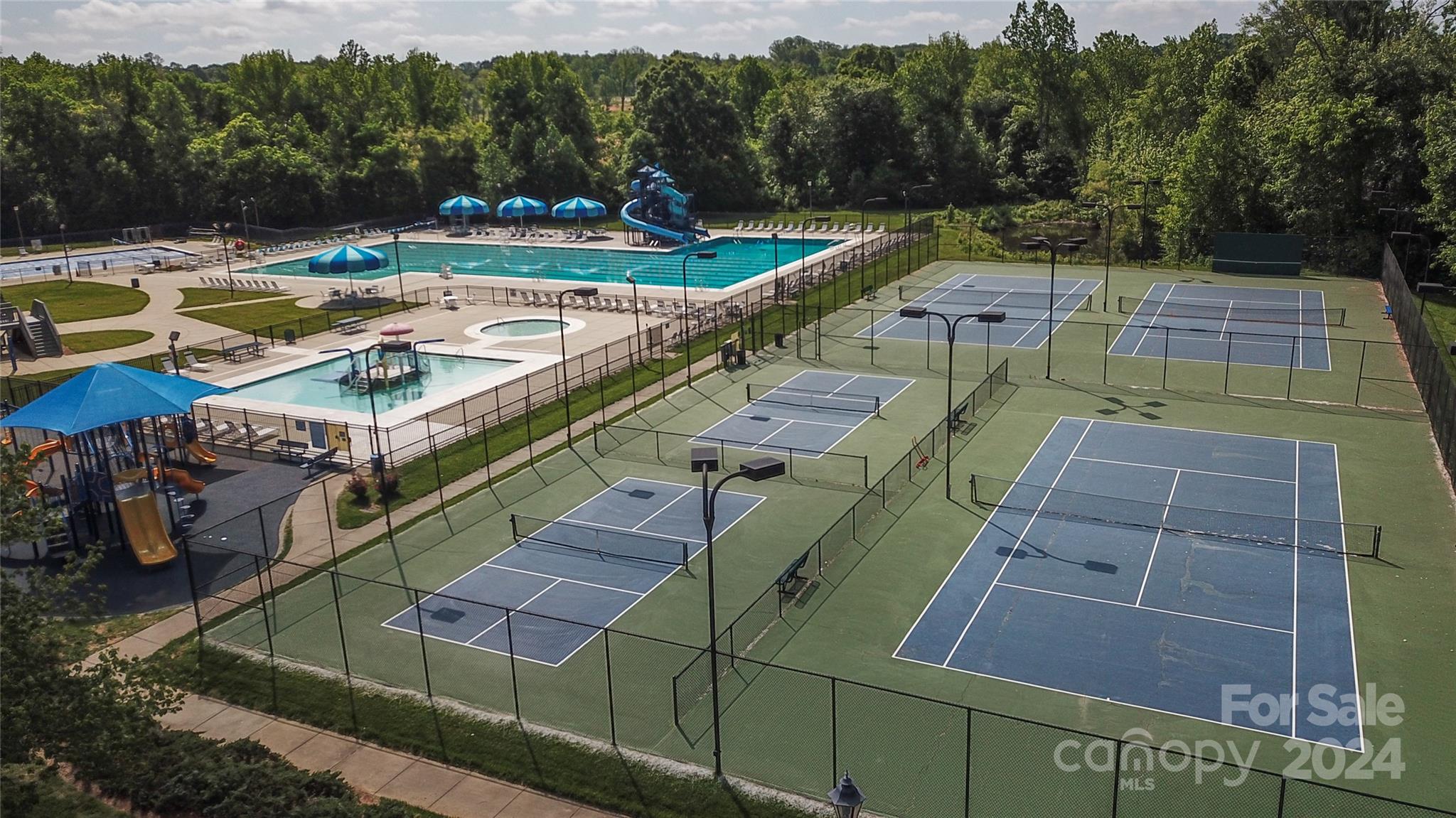 1472 Haverford Road Northwest Concord, NC 28027 - Photo 22 of 30 a view of a swimming pool with a patio