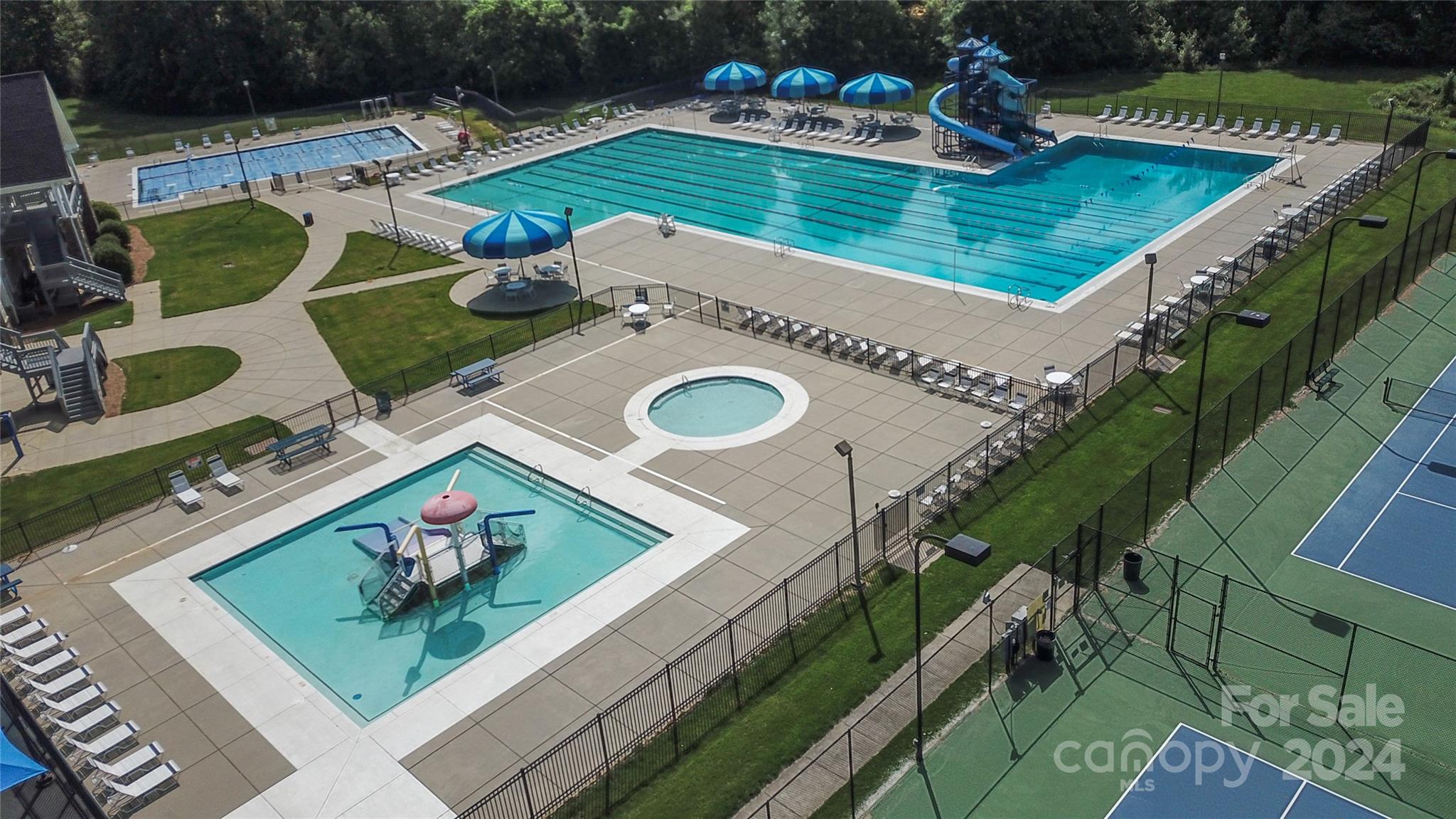 1472 Haverford Road Northwest Concord, NC 28027 - Photo 23 of 30 swimming pool with couple of chairs and wooden floor