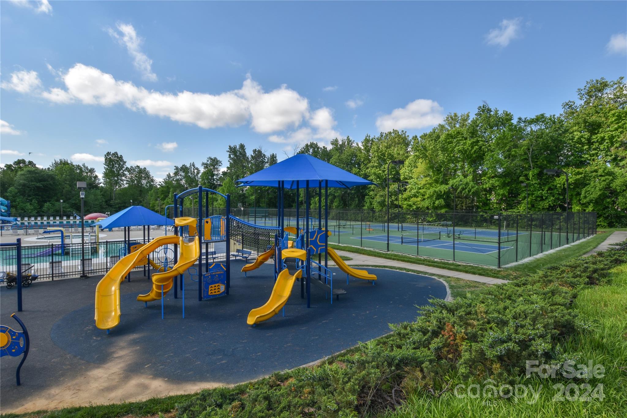 1472 Haverford Road Northwest Concord, NC 28027 - Photo 27 of 30 a view of a park with a slide and potted plants