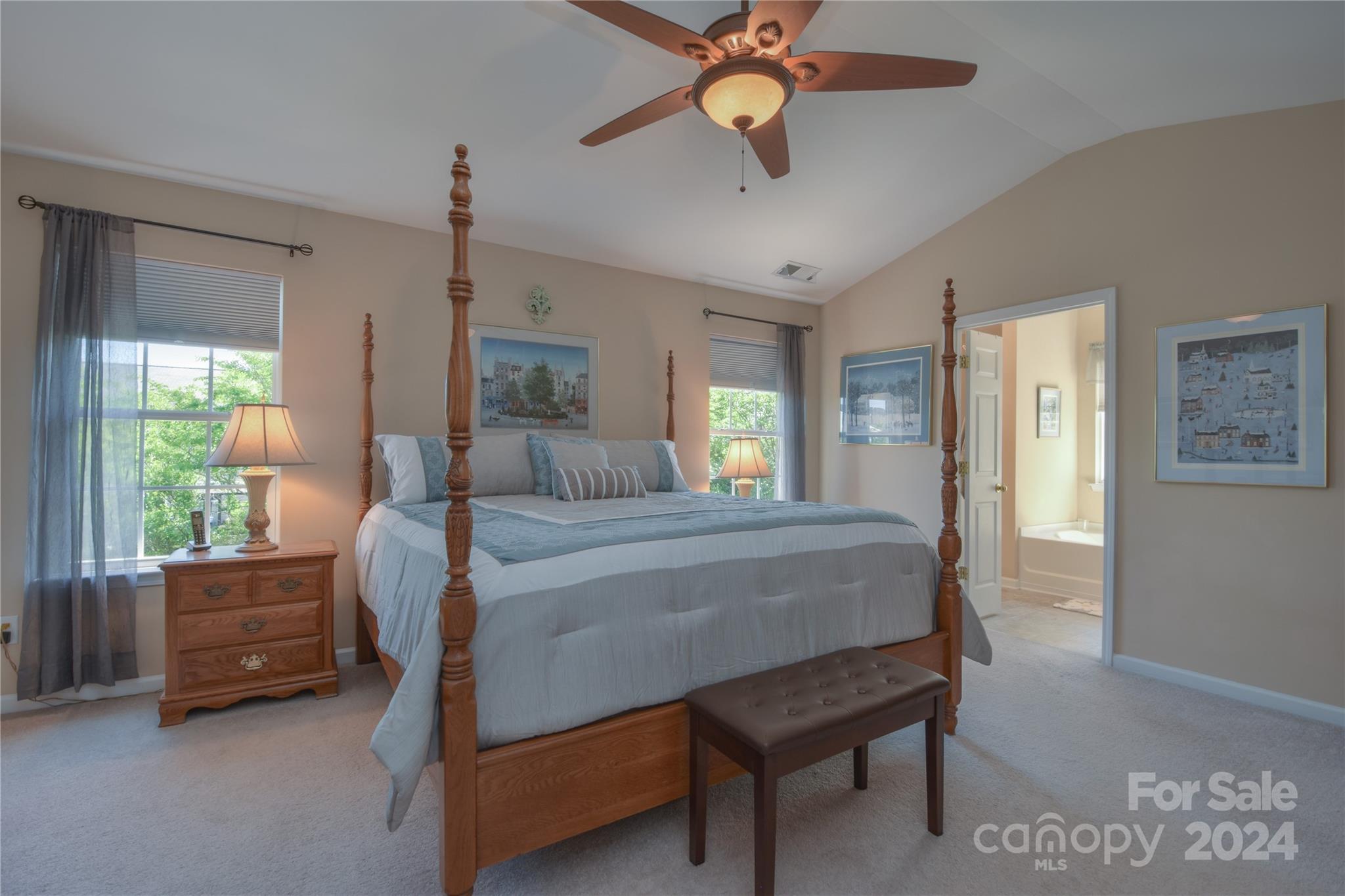 1472 Haverford Road Northwest Concord, NC 28027 - Photo 9 of 30 a bedroom with a bed chandelier and a window