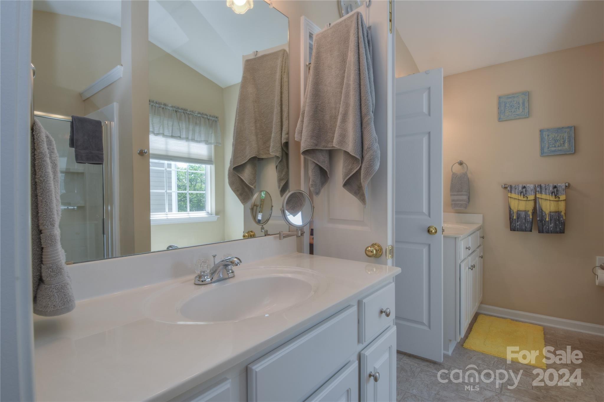 1472 Haverford Road Northwest Concord, NC 28027 - Photo 10 of 30 a bathroom with a sink and a mirror