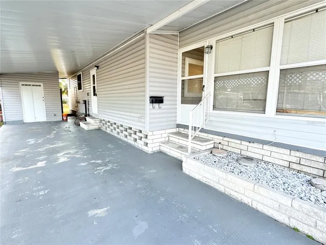 a view of a house with a backyard and a window