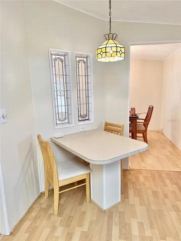 a view of a dining room with furniture and window
