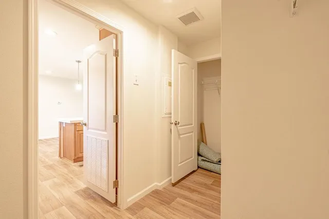 a view of a bathroom from a hallway