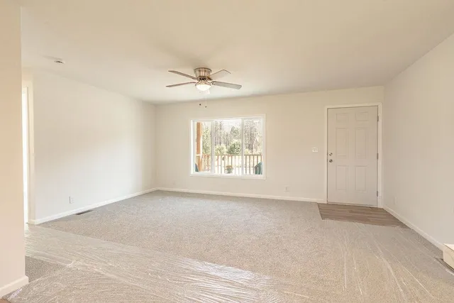 a view of an empty room with a window