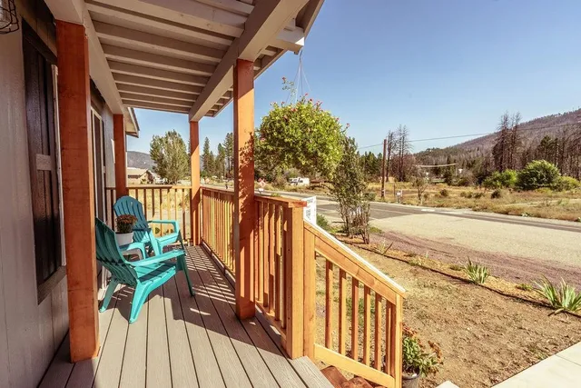 a view of a balcony with wooden floor