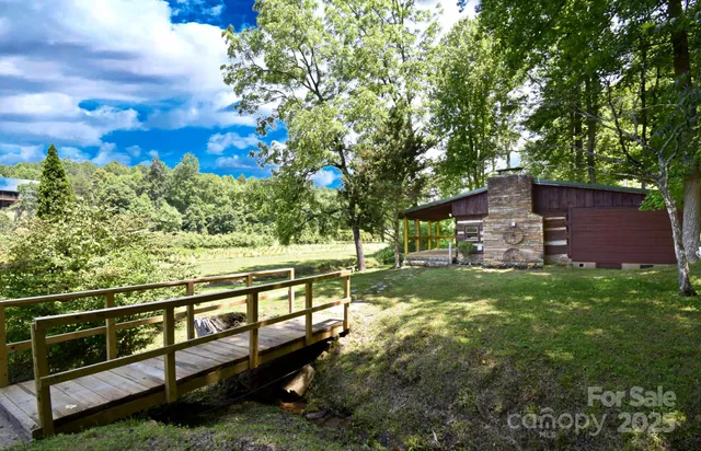 a view of a yard with large trees