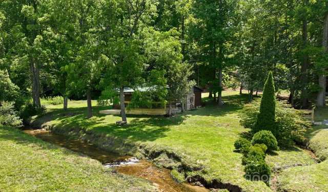 a backyard of a house with lots of green space