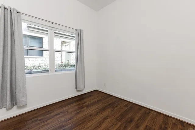 a bathroom with a sink toilet and mirror
