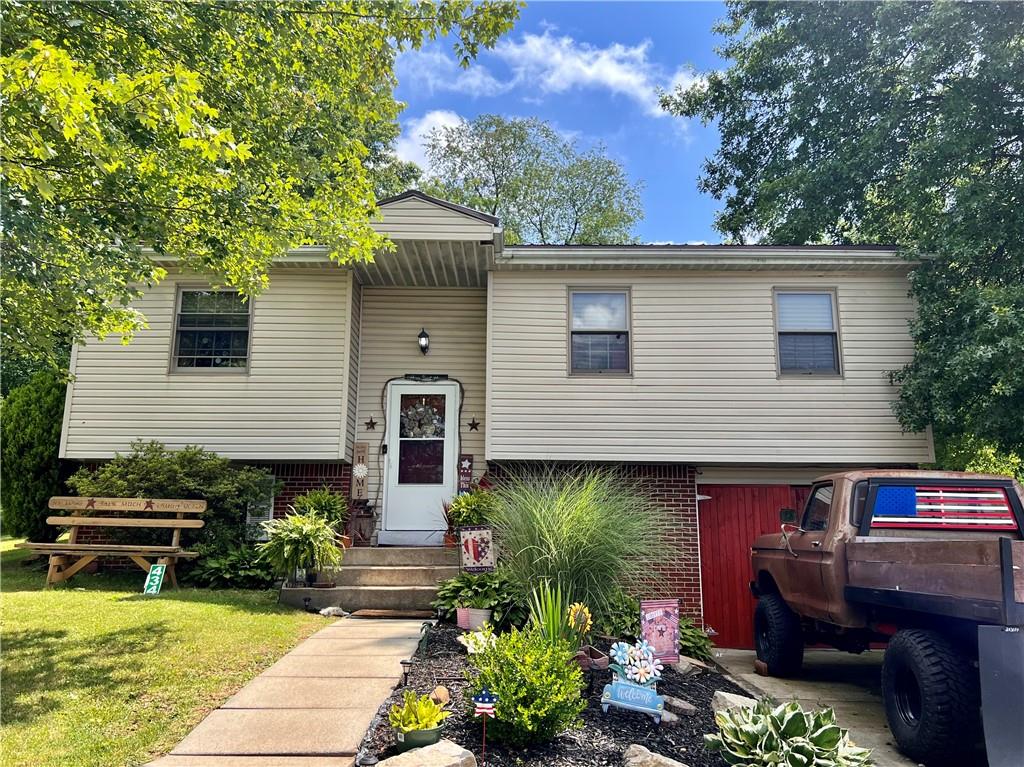 a view of a chairs and table in the back yard of the house