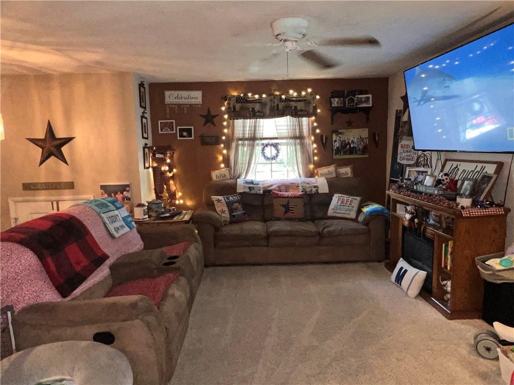 434 Highway 356 Apollo, PA 15613 - Photo 8 of 18 a living room with furniture a projector and screen