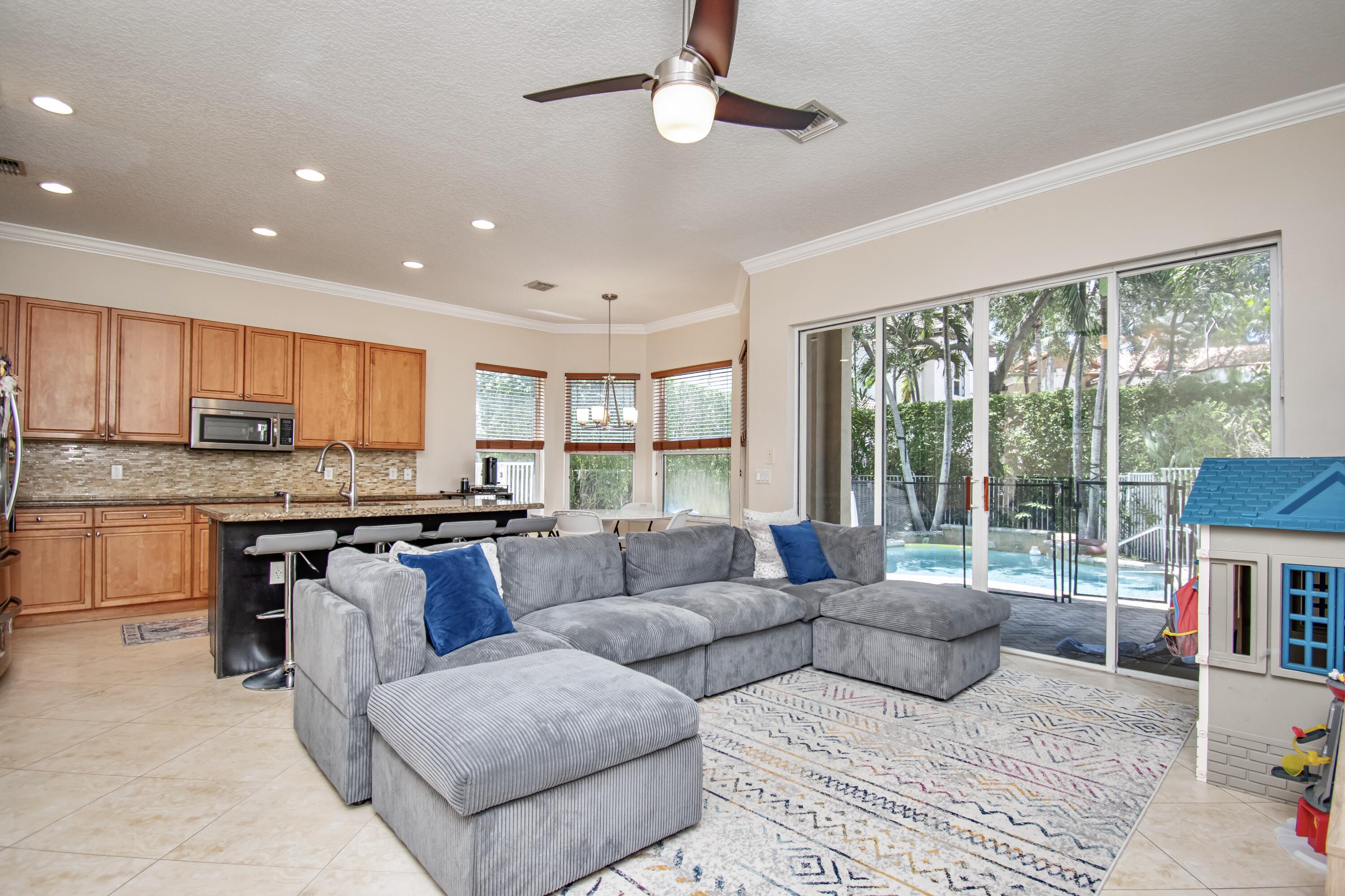 9851 Palma Vista Way Boca Raton, FL 33428 - Photo 14 of 33 a living room with furniture and a large window