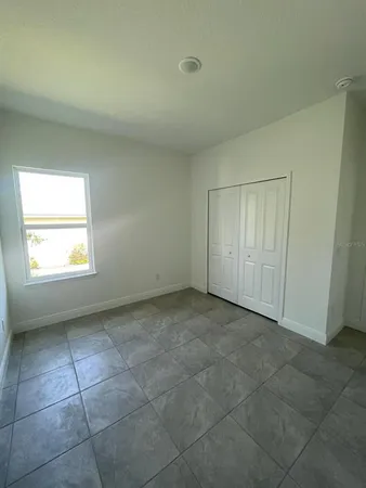 an empty room with a bathroom