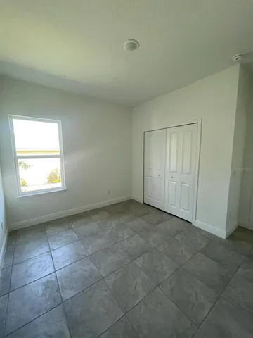 an empty room with a bathroom