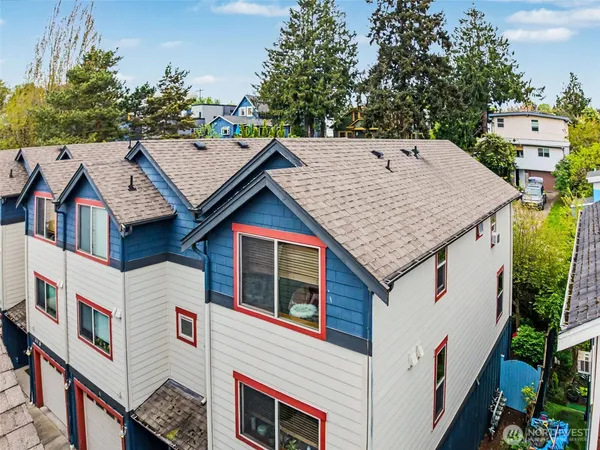 an aerial view of residential houses with outdoor space