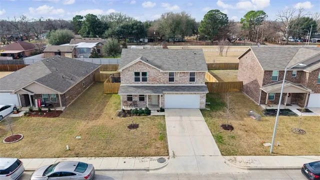 an aerial view of a house with swimming pool