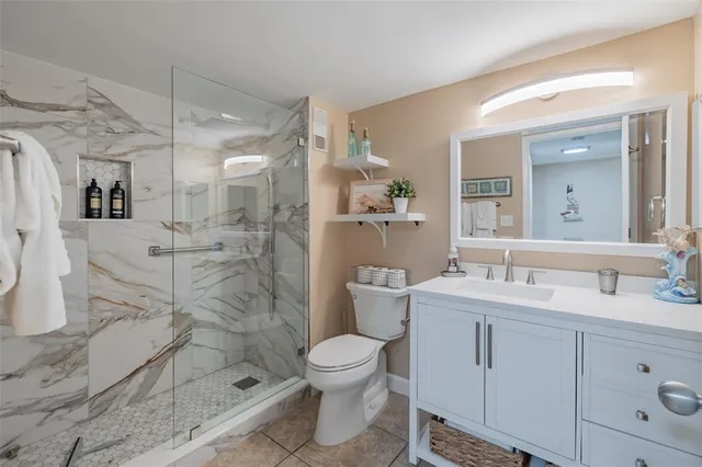 a bathroom with a toilet sink and shower
