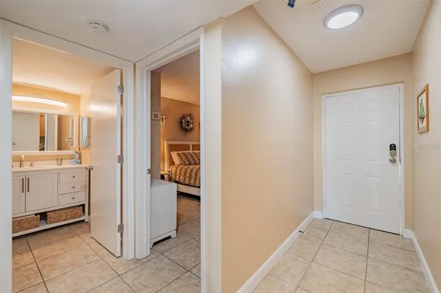 a view of a hallway to closet and a utility room