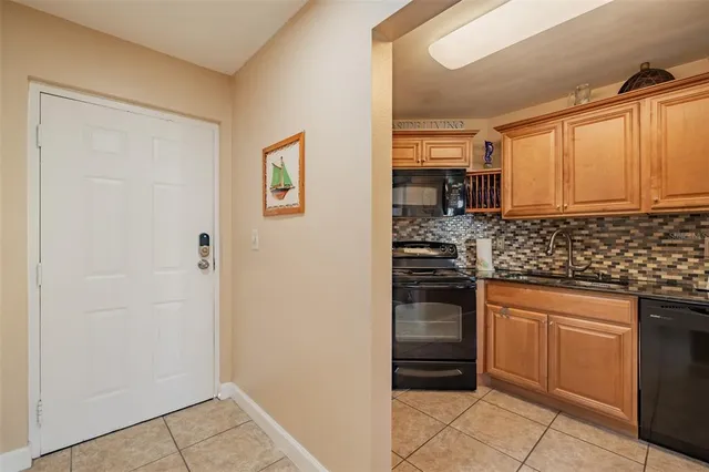 a kitchen with a sink cabinets and appliances