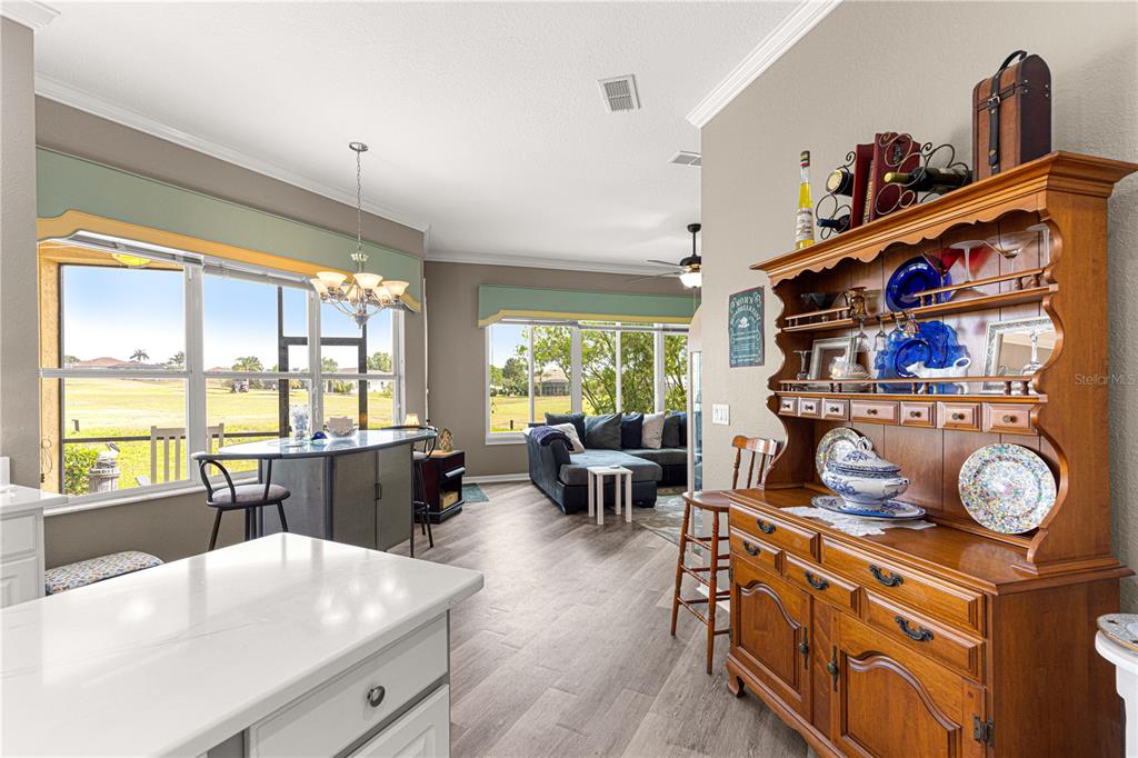 11799 Southeast 173rd Ln Road Summerfield, FL 34491 - Photo 16 of 83 a living room with furniture a flat screen tv and a large window
