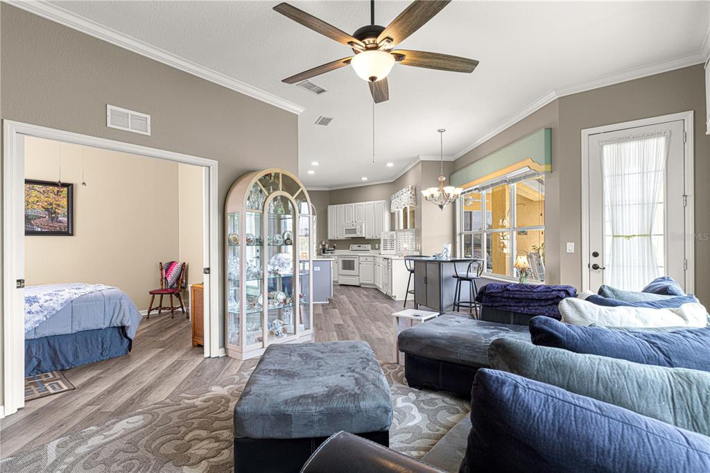 11799 Southeast 173rd Ln Road Summerfield, FL 34491 - Photo 22 of 83 a living room with furniture ceiling fan and a window
