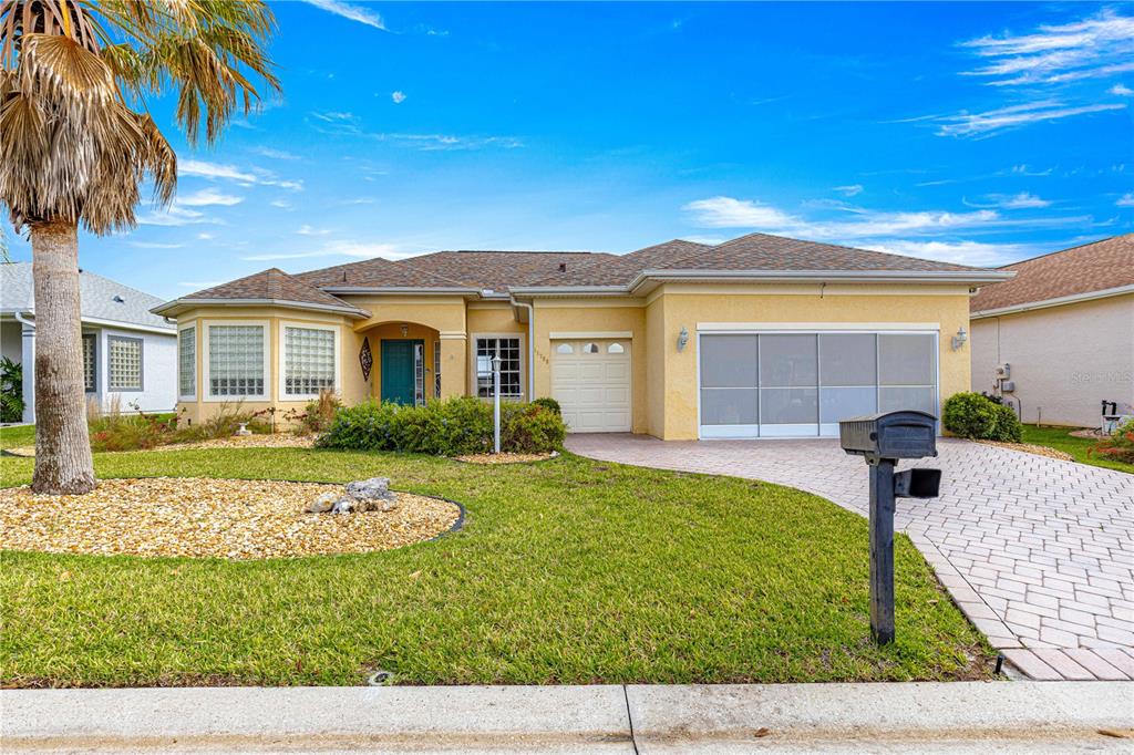 11799 Southeast 173rd Ln Road Summerfield, FL 34491 - Photo 3 of 83 a front view of a house with a yard