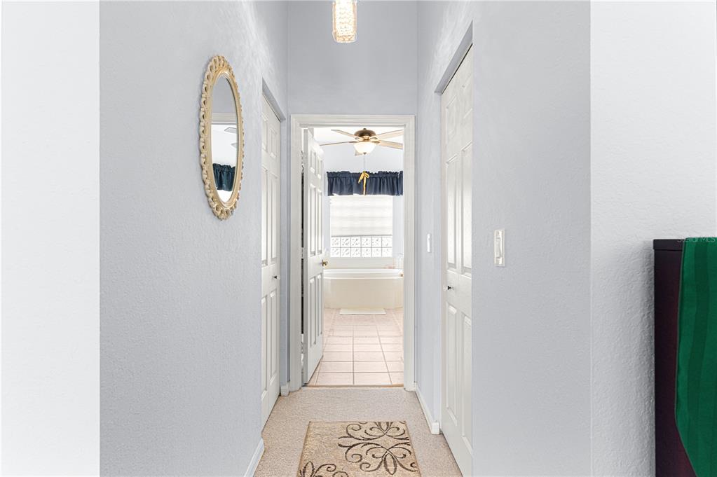 11799 Southeast 173rd Ln Road Summerfield, FL 34491 - Photo 36 of 83 a view of a hallway with wooden floor and a window